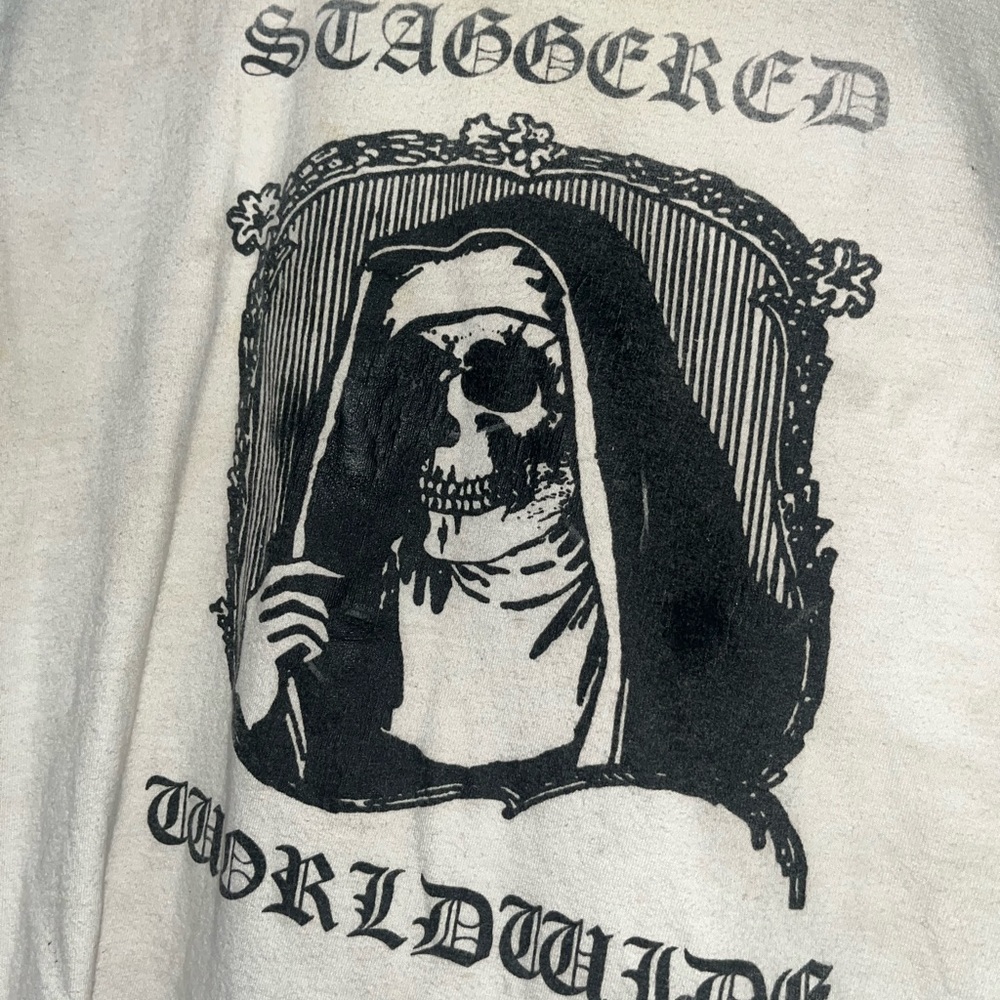 Staggered Worldwide shirt, stained